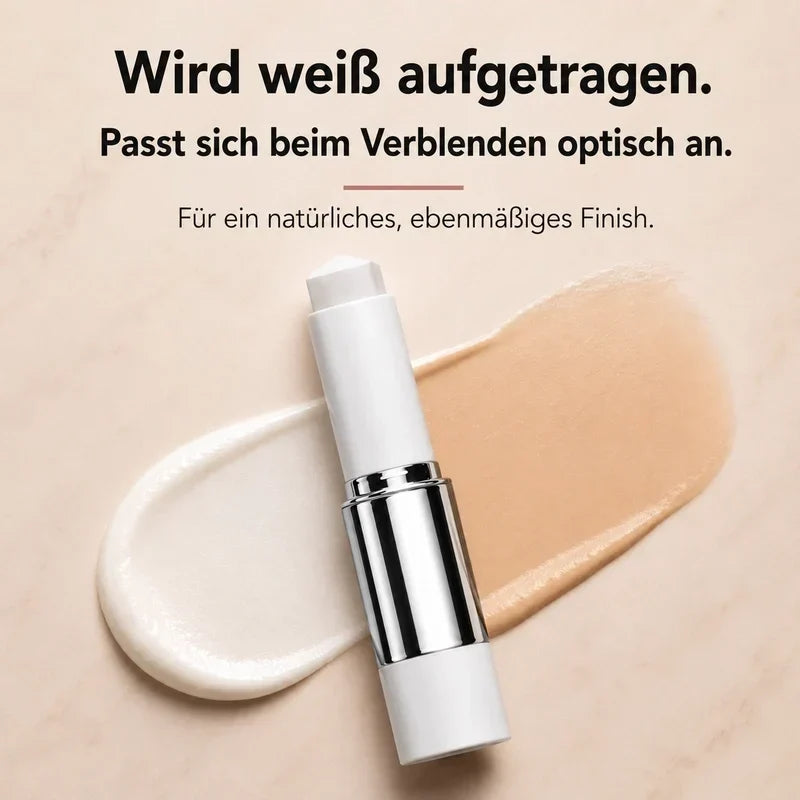 Color-Adjusting 2-in-1 Foundation open white stick on a smear showing white formula blending to a skin tone.