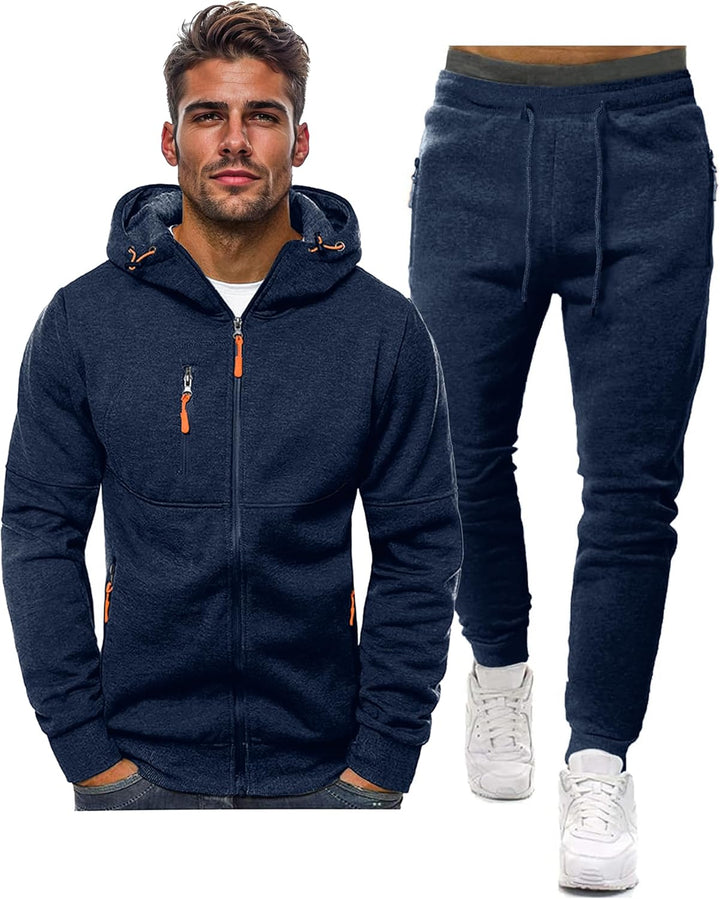 Navy hooded zip jacket on a model beside matching drawstring jogger pants, with orange zipper pulls 2