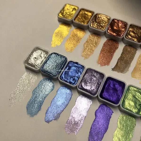 Detail of silver, teal, blue, lavender and violet shimmer pans with sparkly swatches above a row of golden pans.