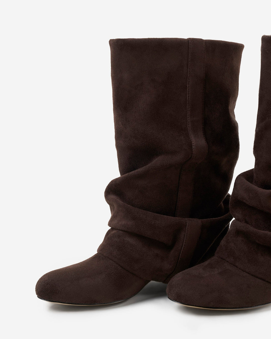 Close-up of the boots showing the soft suede texture, rounded toes, stitched seam and layered folds of the slouchy shaft, 6