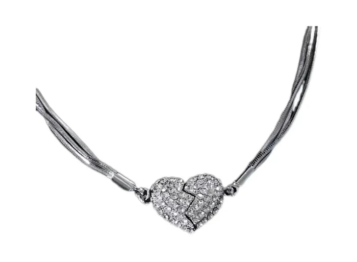 Front-facing product shot on white of the multi-strand silver chain with the crystal-covered heart, its crack line showing where the two halves join. 4