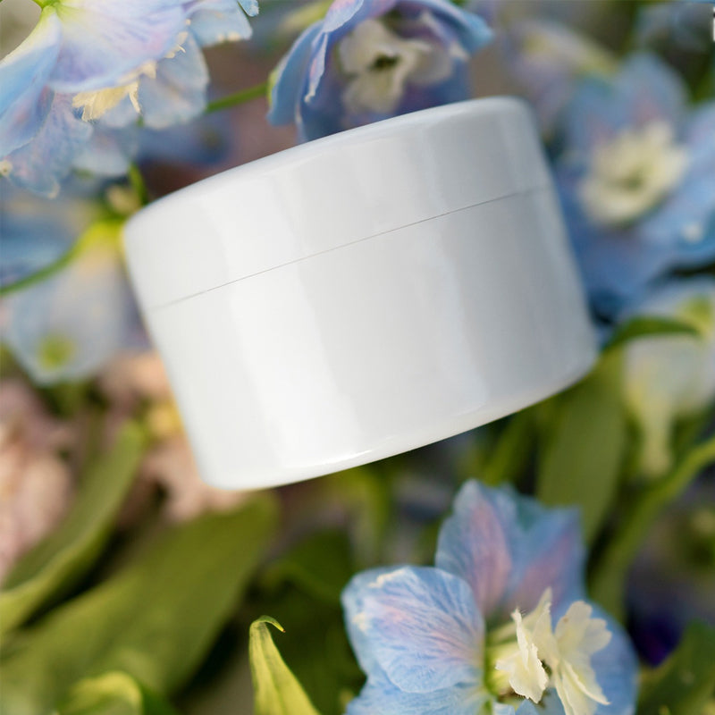 White round flower arranger vase insert with a visible seam