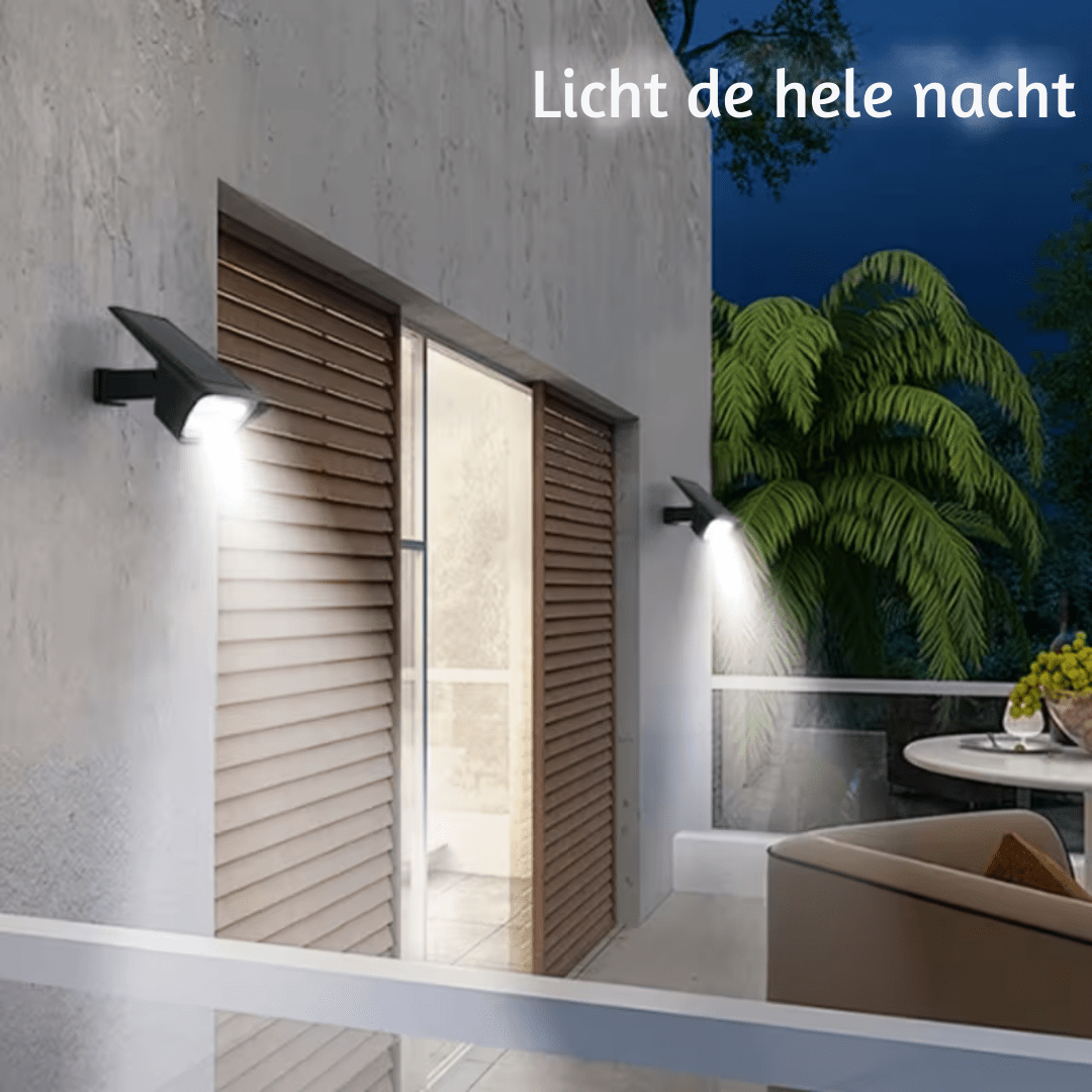 Two black solar lights mounted on an exterior wall beside wooden shutters.