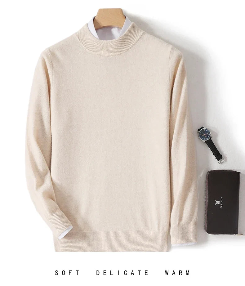 Beige knit sweater on a hanger over a white shirt, with a watch and wallet beside it 8