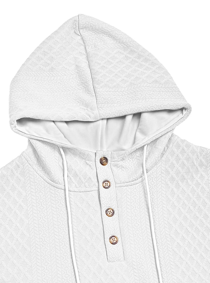 Close-up of a white hoodie's hood and four-button placket with textured diamond knit and white drawstrings 8
