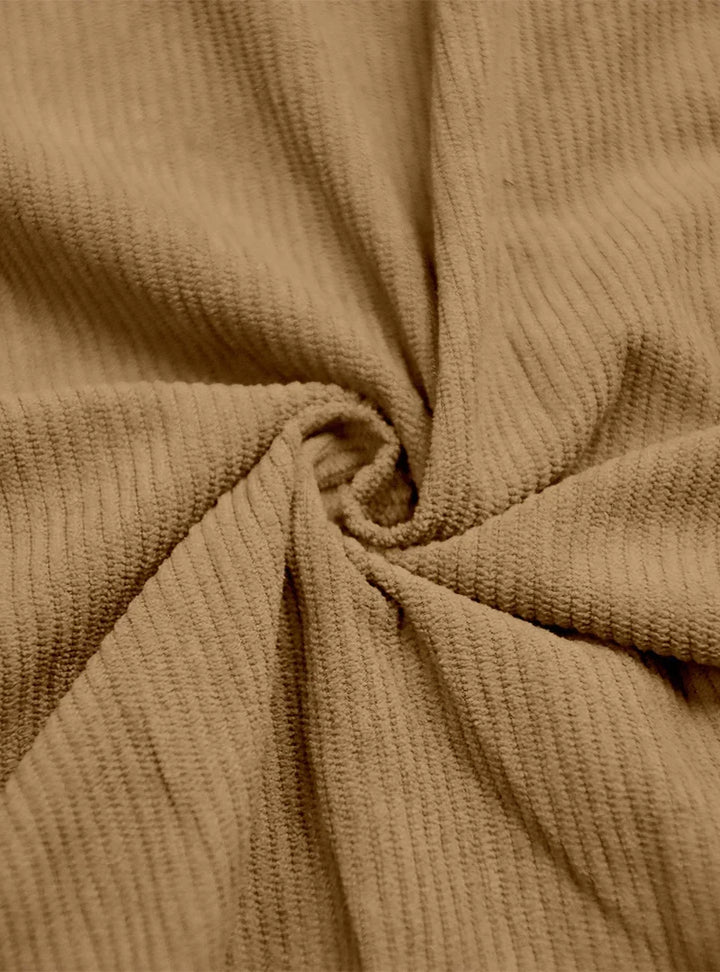 Close-up of twisted tan ribbed fabric showing the soft corduroy-like texture 8