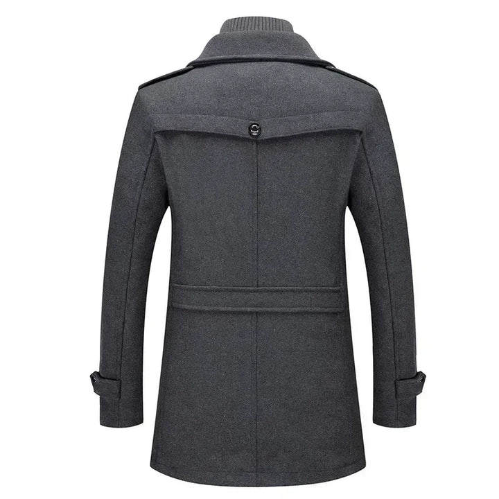 Back view of the gray coat with a button yoke flap, waist strap and sleeve tabs 8