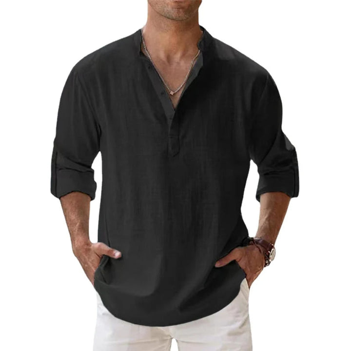 Men's linen Henley shirt in black with rolled sleeves and a button neck.