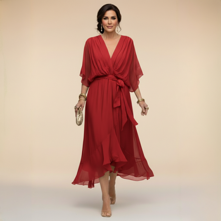 Rich red midi dress detail with a V-neck and knotted waist sash.