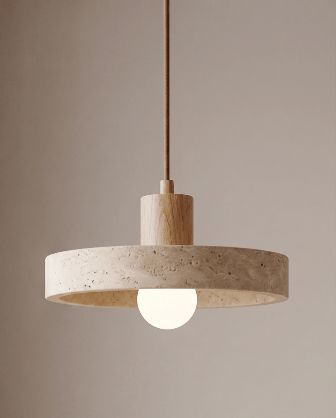 Travertine pendant light with a light oak wood cylinder and globe bulb, lit front view.