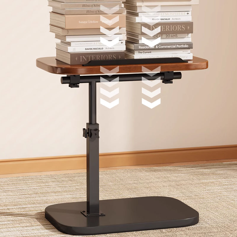 Black rolling laptop desk detail with books showing the weight capacity