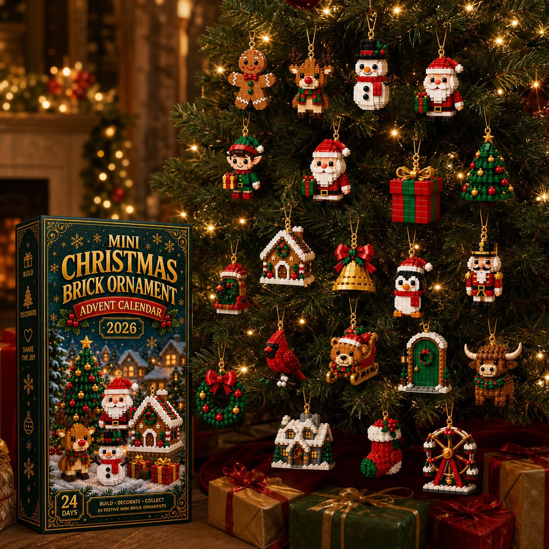 Nearly two dozen finished brick ornaments hanging on a glowing Christmas tree, with the box standing at left and wrapped gifts below.