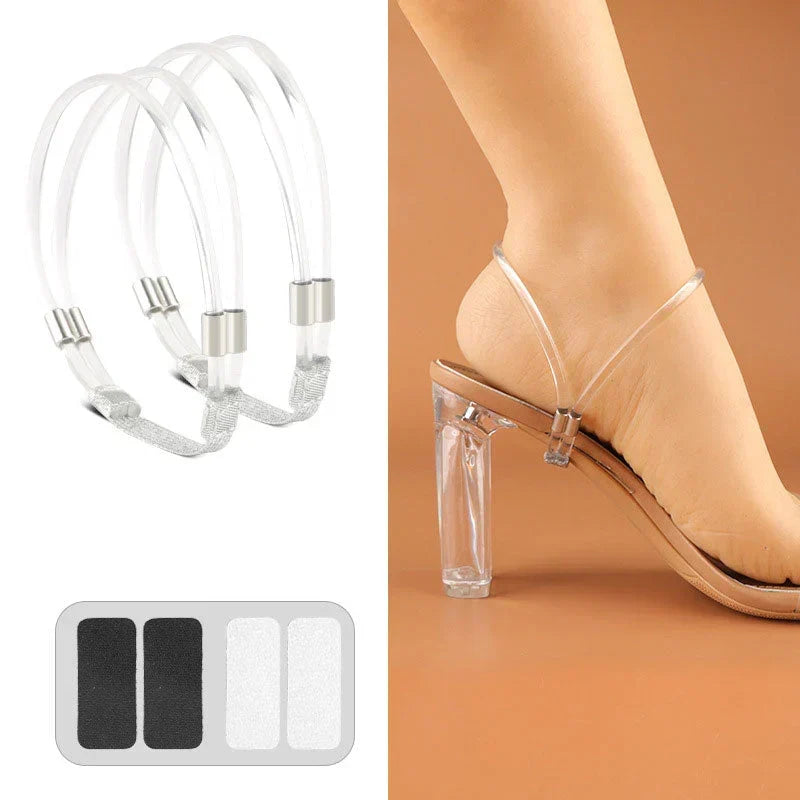 Pair of transparent clear shoe straps with metal clasps and adhesive pads on a clear-heeled sandal.