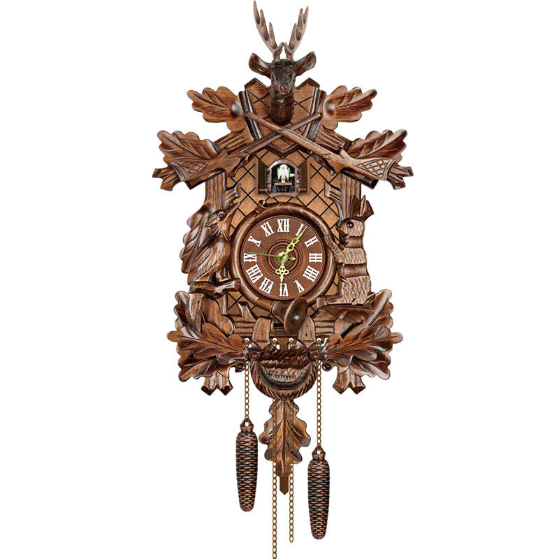Carved hunting-style wooden clock with antlers, crossed rifles, oak leaves, animal carvings and Roman numeral dial 10