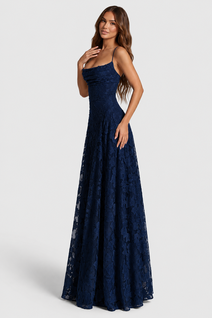 Navy floral lace dress shown at an angle, with bodice seaming visible.