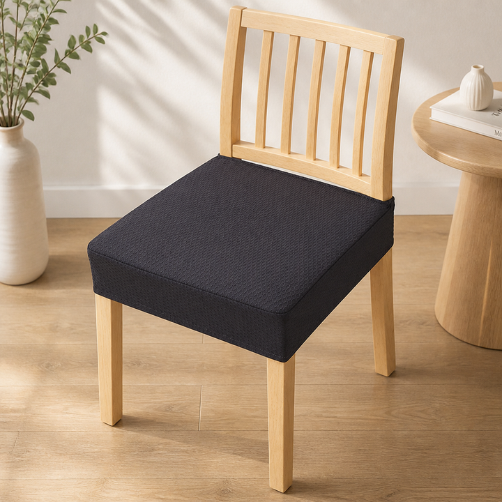 Black diamond-textured seat cover on a light wood chair, another view.