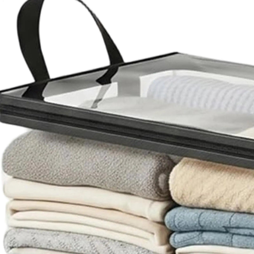 Clear storage bag detail showing the clear top panel, black zipper edge and a handle above folded textiles.
