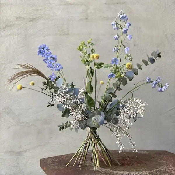 Another view of a bouquet held upright by flower stems