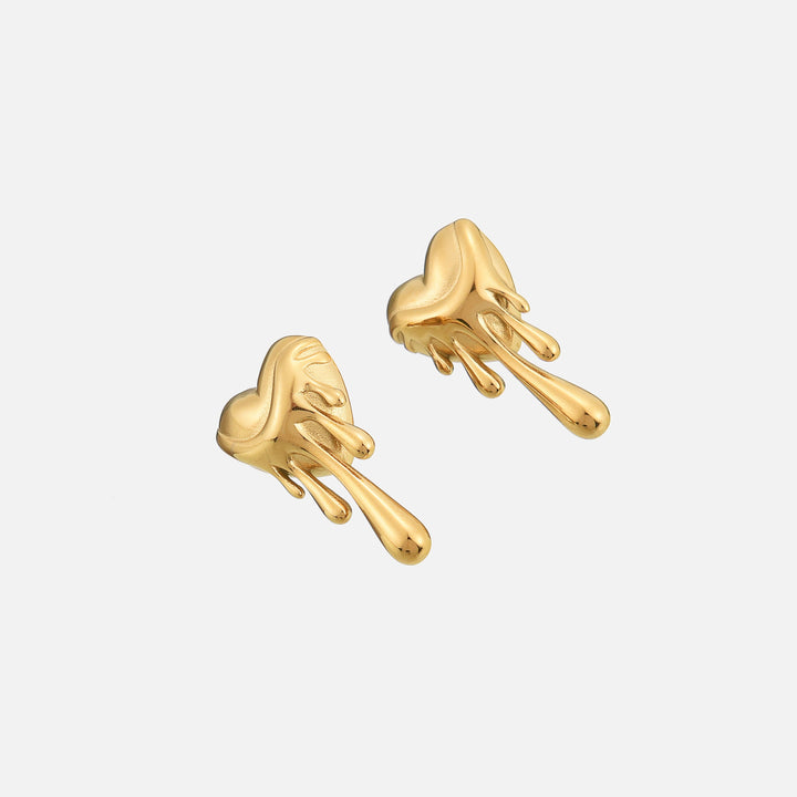 Angled view of two gold melting heart earrings, showing the glossy dripping drops and their depth 2