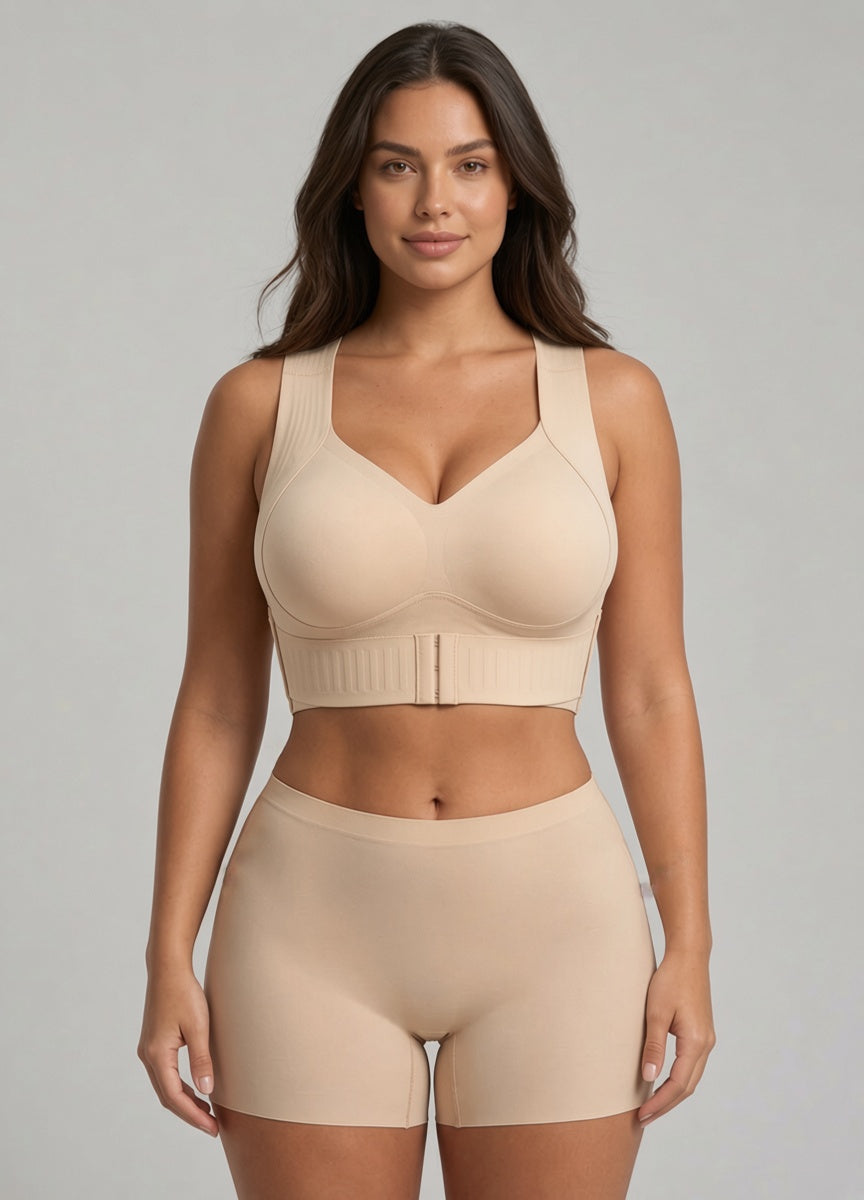 Beige V-neck bra with front hook closure and matching seamless shorts on a model.