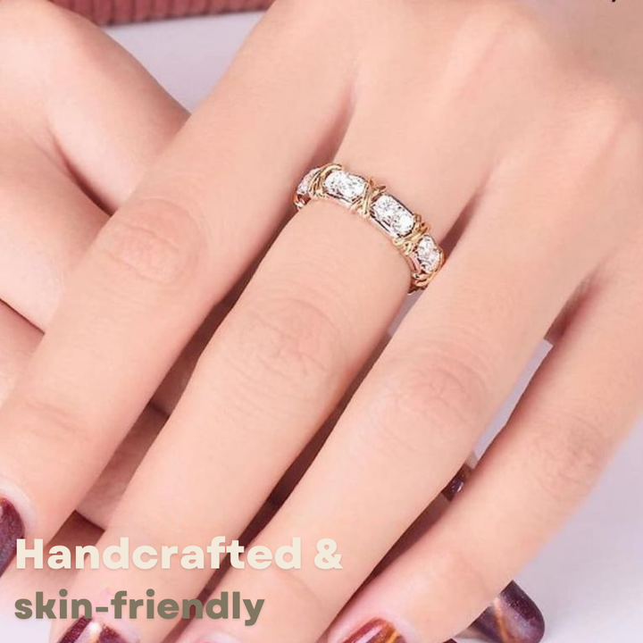 Magnetic wellness ring close-up on a hand with dark red nails