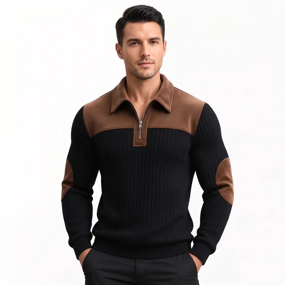 Man wearing the black ribbed pullover with brown collar and elbow patches, hands in dark pants pockets 9