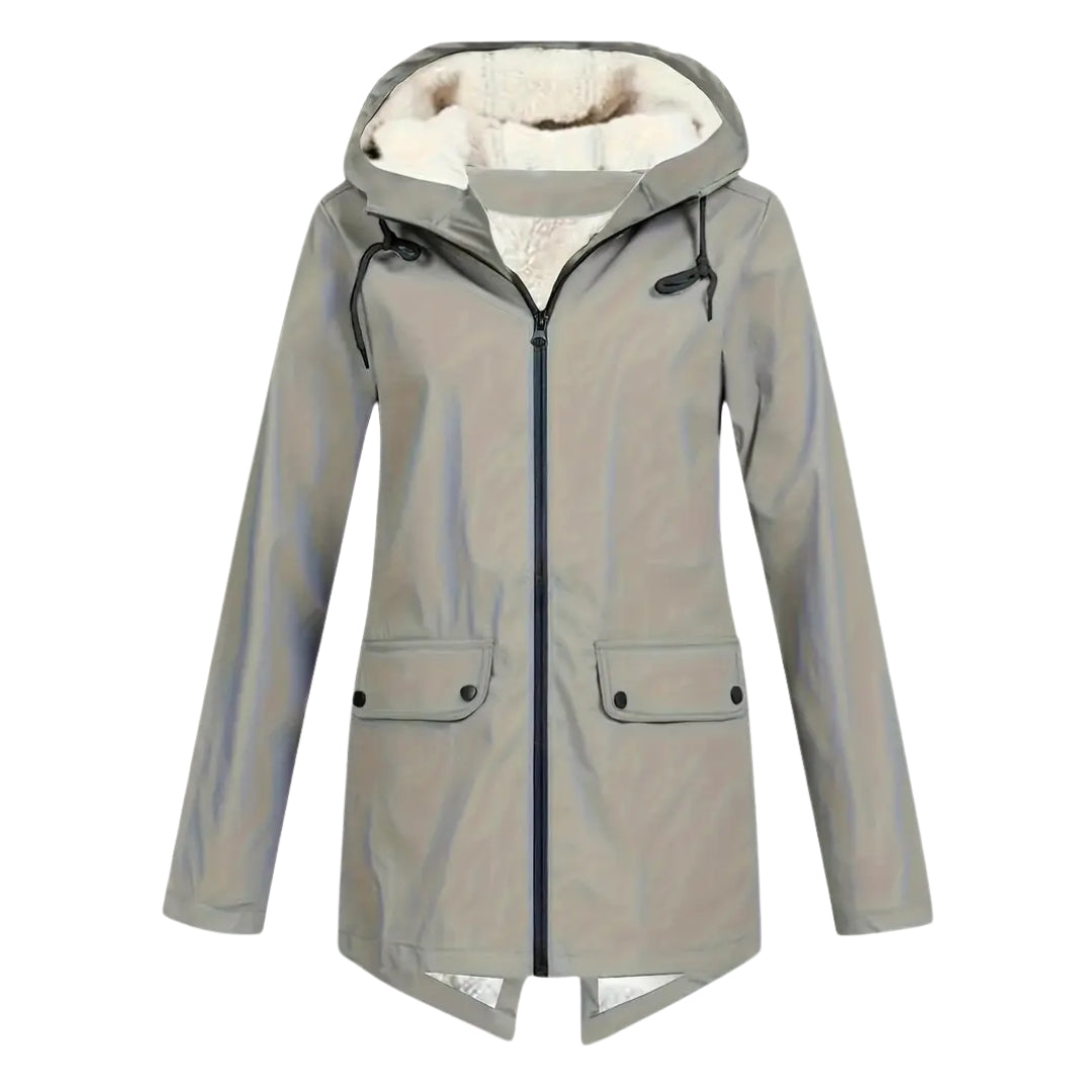 Flat lay detail of the gray-green version of the jacket with cream fleece-lined hood, black zipper and flap pockets.