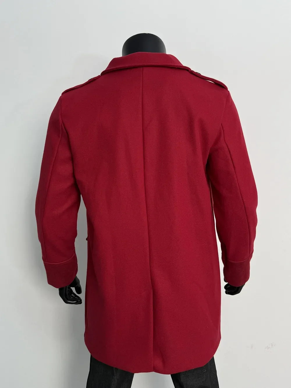 Back view of the red coat on a mannequin, showing the center back seam and shoulder epaulettes 9