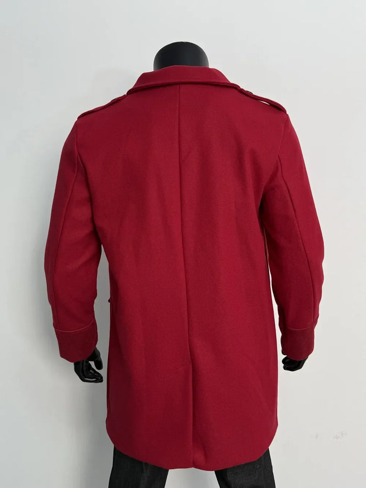 Back view of the red coat on a mannequin, showing the center back seam and shoulder epaulettes 9