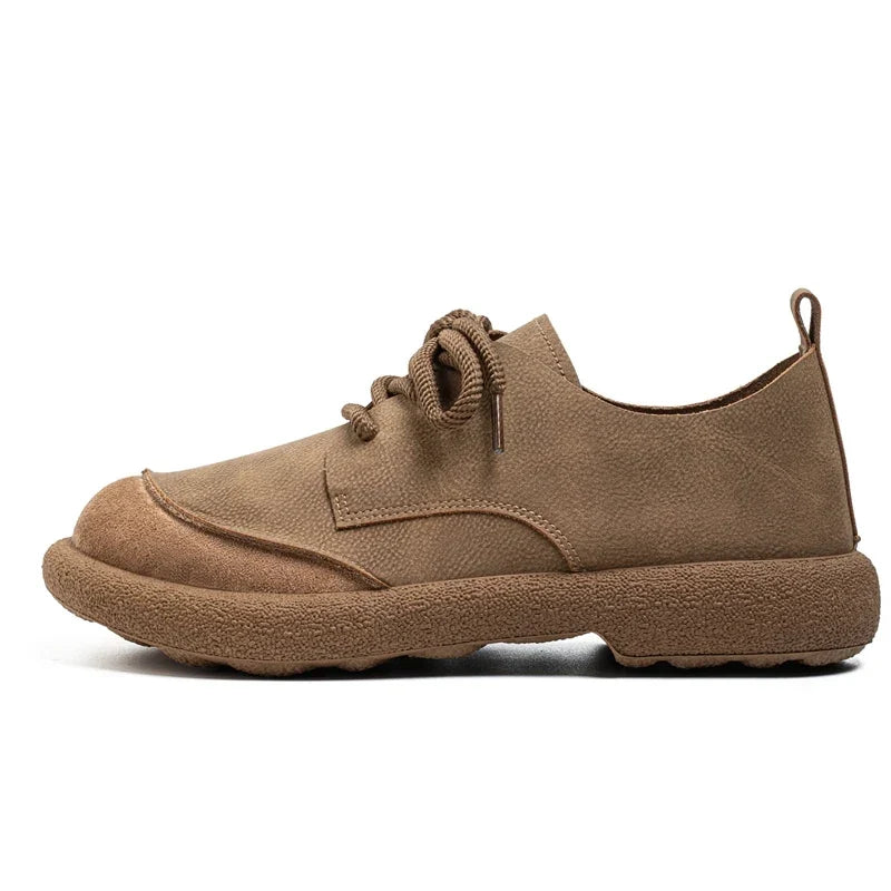 Side view of a khaki lace-up shoe with suede toe cap and matching sole 9