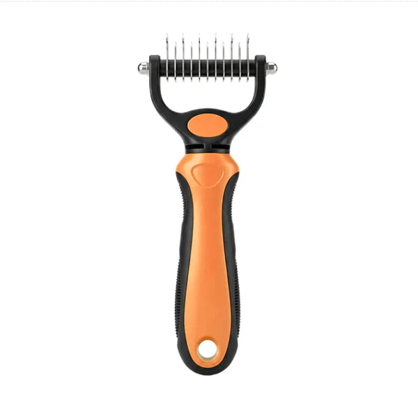 Orange and black grooming rake seen from the front on a white background 14