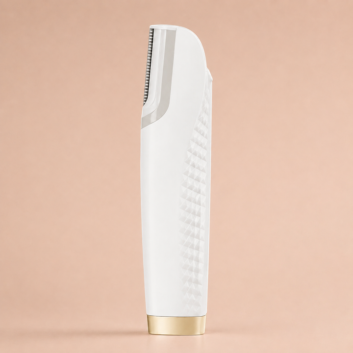 White version of the hair remover standing upright, showing its textured diamond grip, silver blade head and gold base.