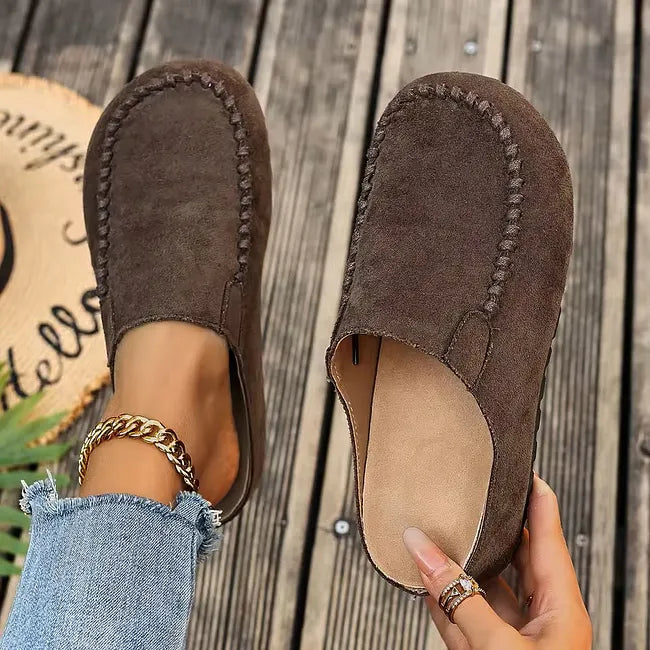 Brown leather slip-on sandals with a suede-like upper, another view with light tan insole.