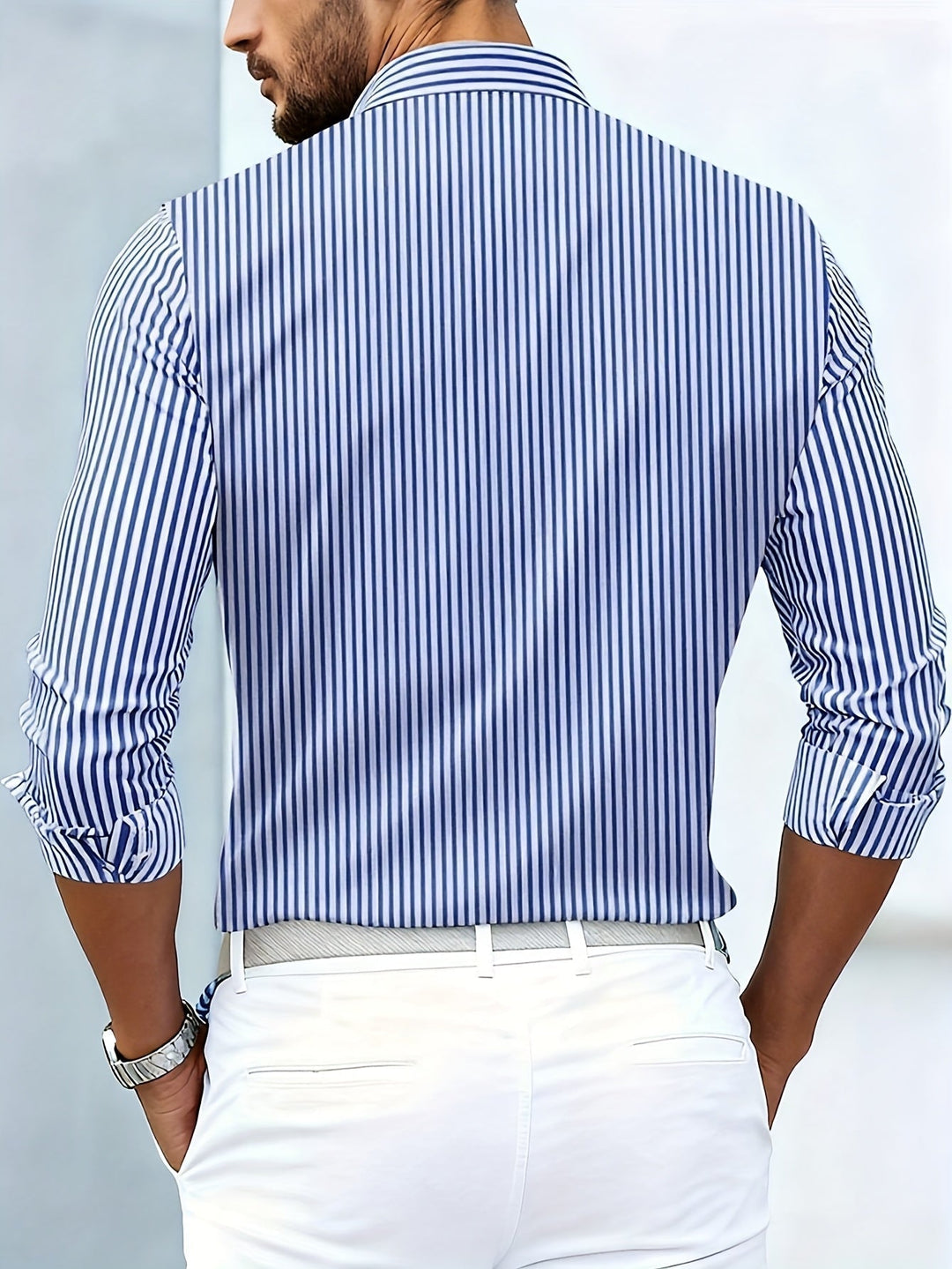 Blue and white striped shirt, back view on a model.