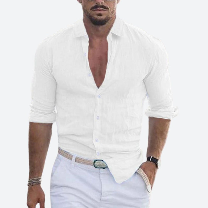 Men's linen shirt in white with an open collar and rolled sleeves.