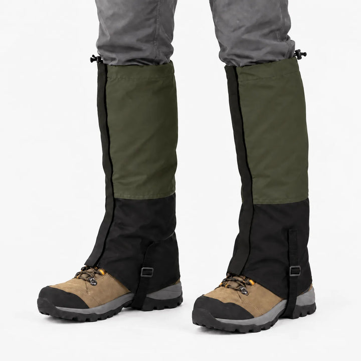 Olive green and black gaiters worn over hiking boots, studio front view with adjustable top cords and boot straps. 10