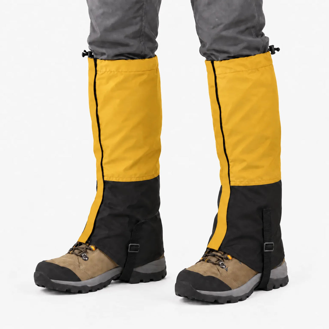 Mustard yellow and black gaiters worn over hiking boots, front studio view with drawcord tops and boot straps. 13
