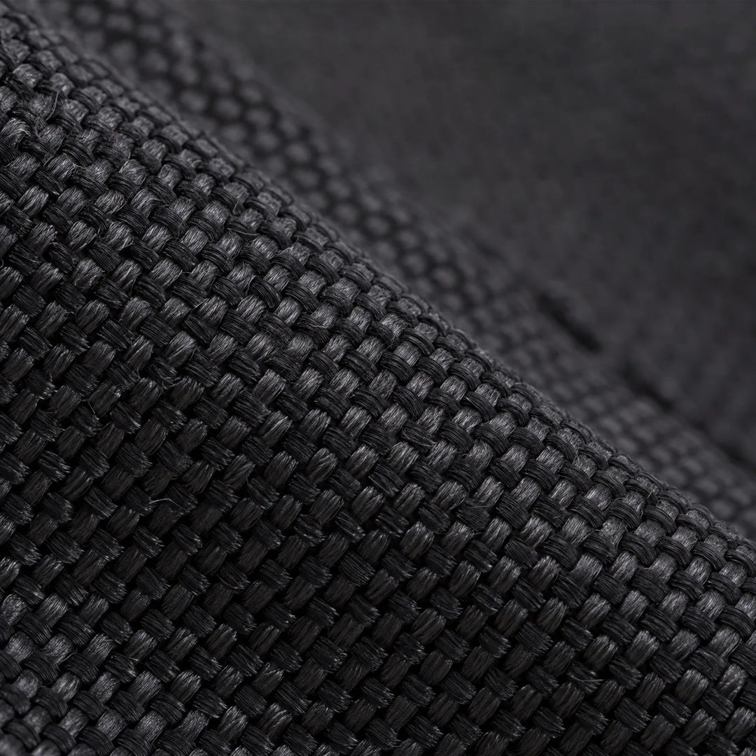 Extreme close-up of the black woven fabric used on the lower gaiter, showing its tight, textured weave. 5