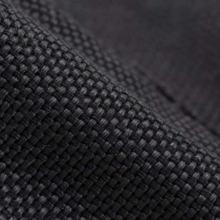 Extreme close-up of the black woven fabric used on the lower gaiter, showing its tight, textured weave. 5