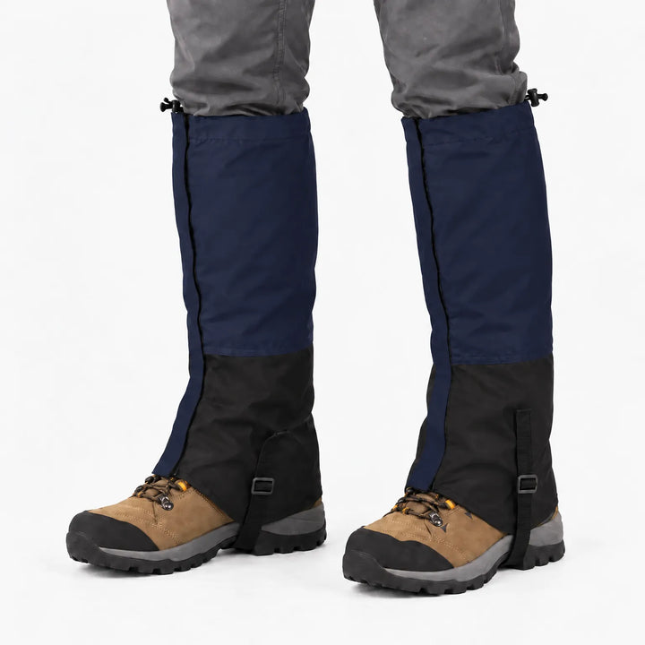Navy blue and black gaiters worn over hiking boots, front view with drawcord tops and under-boot straps. 6