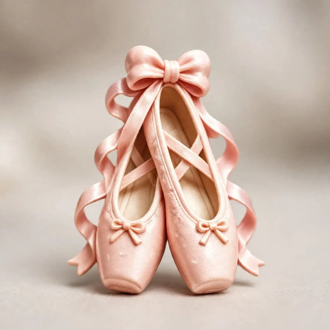 Close-up of a pink satin-look ballet slipper ornament tied with ribbons and a bow 3