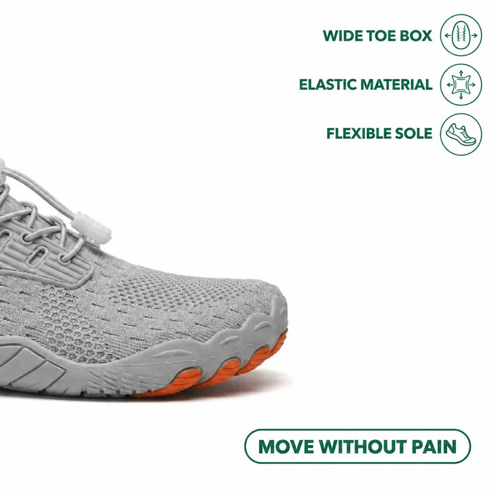 Close-up of the gray sneaker's wide toe box with orange toe tips, plus icons for elastic material and flexible sole.