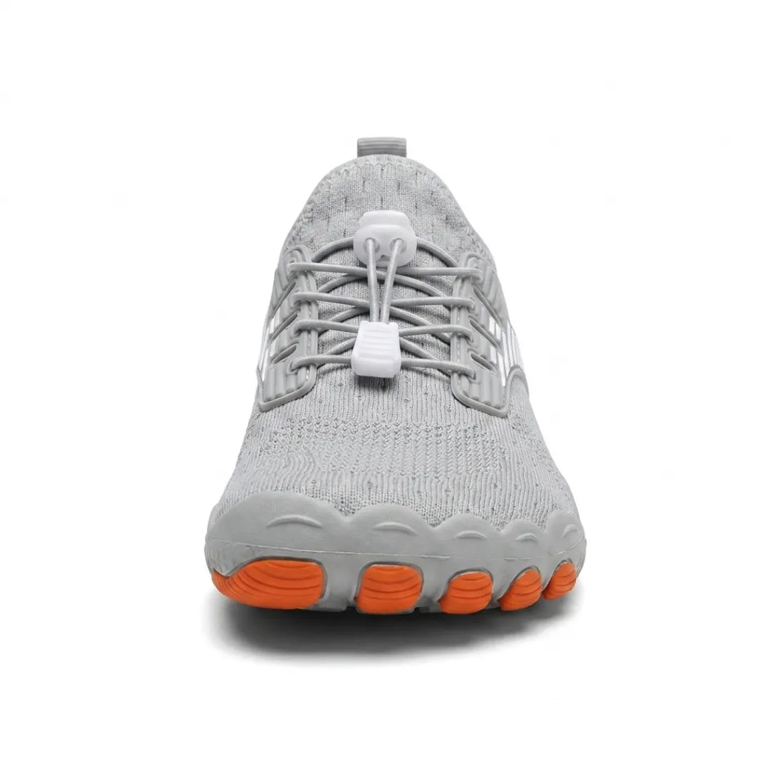 Front view of a gray sneaker showing the orange-tipped toe segments and elastic lacing with a white toggle.
