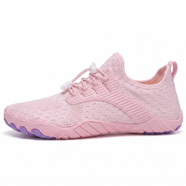 Side view of a pink knit sneaker with elastic laces, white toggles and purple toe-shaped sole pods. 25