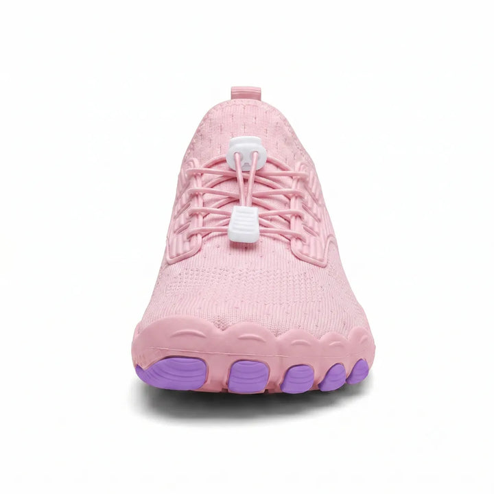 Front view of a pink sneaker showing the wide toe box, elastic laces and five purple toe-shaped sole pods. 30