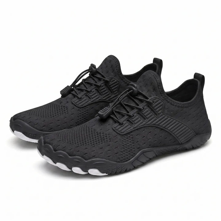 Pair of black knit barefoot sneakers with elastic toggle laces and white toe-shaped sole pods, shown at an angle. 36
