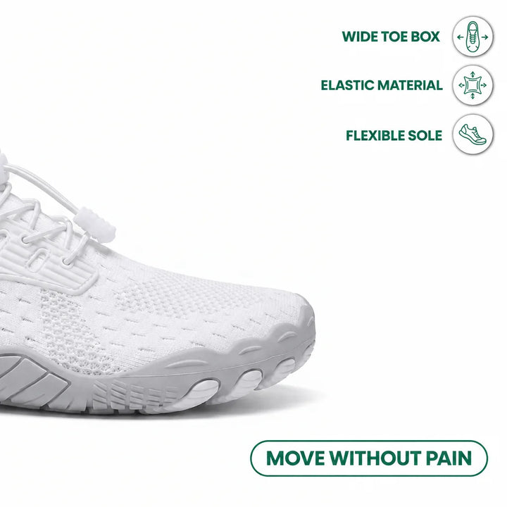 Close-up of the white sneaker's wide toe area and flexible sole, with icons for toe box, elastic material and sole.