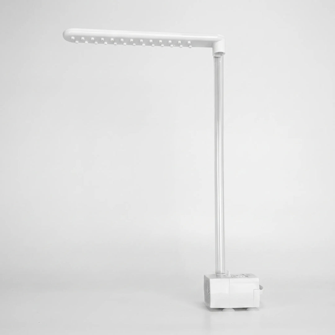 Dry product on a plain background, showing the white spray arm with its rows of nozzle studs, the clear tube and the pump base. 5