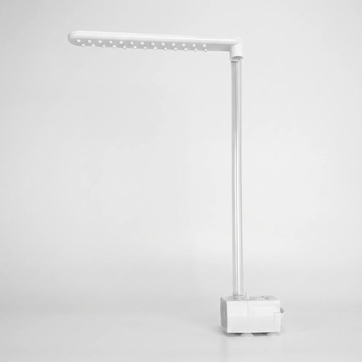 Dry product on a plain background, showing the white spray arm with its rows of nozzle studs, the clear tube and the pump base. 5