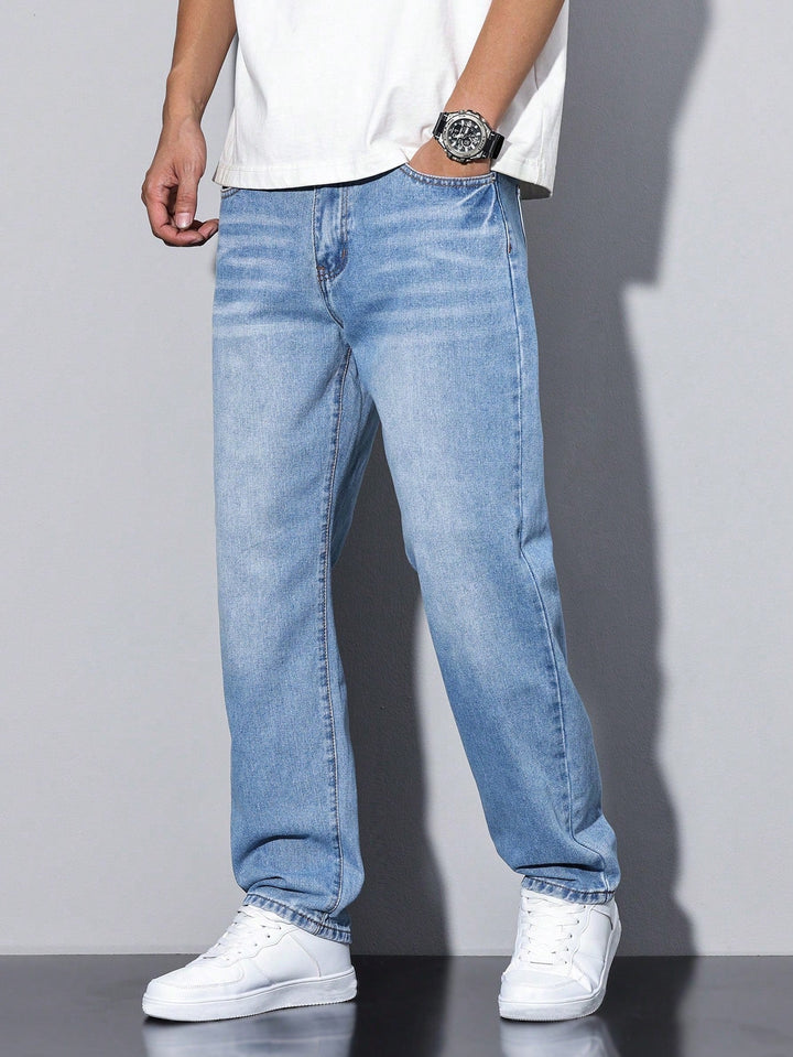 Men's baggy jeans in light blue washed denim, another view on a model with a hand in the pocket.